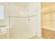 Bright bathroom features a glass shower, soaking tub, and neutral tiling detail at 1774 Pasture Loop, Oviedo, FL 32765