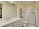 Bright bathroom featuring a single vanity, shower with glass door, and neutral color palette at 1774 Pasture Loop, Oviedo, FL 32765