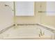 Bright bathroom features a tiled bathtub with mosaic accents at 1774 Pasture Loop, Oviedo, FL 32765