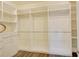 Walk-in closet features adjustable shelving and rods for versatile storage options at 1774 Pasture Loop, Oviedo, FL 32765