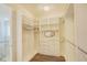Walk-in closet features adjustable shelving and drawers for ample storage space at 1774 Pasture Loop, Oviedo, FL 32765