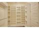 Spacious walk-in closet features built-in shelves and drawers for organized storage at 1774 Pasture Loop, Oviedo, FL 32765