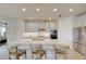 Open concept kitchen with large island, stainless appliances and white cabinets at 1774 Pasture Loop, Oviedo, FL 32765