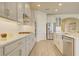 Kitchen features stainless steel appliances, white cabinets and subway tile backsplash at 1774 Pasture Loop, Oviedo, FL 32765