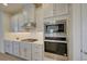 Modern kitchen with stainless steel microwave and oven at 1774 Pasture Loop, Oviedo, FL 32765