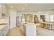 Bright kitchen with a center island, stainless steel appliances, and open layout to the living area at 1774 Pasture Loop, Oviedo, FL 32765