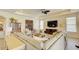 Sunlit living room showcasing a large sectional, decorative art, and modern entertainment center at 1774 Pasture Loop, Oviedo, FL 32765