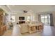 Bright living room showcasing stylish furniture, modern decor, and large windows with scenic views of the outdoors at 1774 Pasture Loop, Oviedo, FL 32765