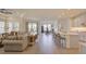 Spacious living area featuring an open layout, modern finishes, and seamless transition to the kitchen and dining spaces at 1774 Pasture Loop, Oviedo, FL 32765