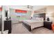 Spacious bedroom with natural light, dresser, ceiling fan, and a comfortable bed at 1909 Majorca Dr, Kissimmee, FL 34747