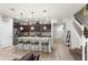 Modern kitchen featuring granite countertops, stainless steel appliances, and a breakfast bar with seating at 1909 Majorca Dr, Kissimmee, FL 34747