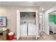 Hallway laundry area with a washer and dryer, conveniently located near the bedroom at 1909 Majorca Dr, Kissimmee, FL 34747