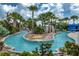 Community lazy river winds through palm trees and lush landscaping providing a tranquil experience at 1909 Majorca Dr, Kissimmee, FL 34747