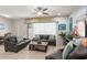 Bright living room showcases neutral walls, tile flooring, and sliding door access to the patio at 1909 Majorca Dr, Kissimmee, FL 34747
