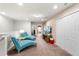 Open loft area featuring two turquoise chaise lounges and a TV for relaxing at 1909 Majorca Dr, Kissimmee, FL 34747