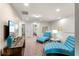 Relaxing loft area with blue chaise lounges, a TV, and a view of other rooms at 1909 Majorca Dr, Kissimmee, FL 34747