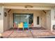 Covered patio with a colorful dining set and views of the pool at 1909 Majorca Dr, Kissimmee, FL 34747