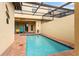 Private swimming pool in a screened enclosure, with a patio and lounge area at 1909 Majorca Dr, Kissimmee, FL 34747