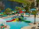 Fun splash pad with slides for and lounge seating around the community pool area at 1909 Majorca Dr, Kissimmee, FL 34747