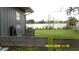 A view of the lake in the backyard, surrounded by lush greenery and mature trees at 1952 English Dr, Deltona, FL 32738