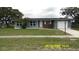 Charming single-story home with well-maintained lawn, attached garage, and inviting curb appeal at 1952 English Dr, Deltona, FL 32738