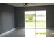Bright living room with sliding glass doors showcasing a scenic view and great natural light at 1952 English Dr, Deltona, FL 32738
