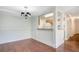 Open dining area featuring hardwood floors and an open kitchen, perfect for entertaining at 2053 Dixie Belle Dr # 2053J, Orlando, FL 32812