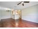Spacious living room with hardwood floors open to the kitchen; perfect for entertaining guests at 2053 Dixie Belle Dr # 2053J, Orlando, FL 32812