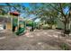A lovely community playground with a play structure, slide, and benches for parents at 2053 Dixie Belle Dr # 2053J, Orlando, FL 32812