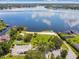 Aerial view of the community beach and park area on the lake with parking and playground equipment at 207 S Sweetwater Blvd, Longwood, FL 32779