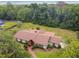 A beautiful aerial view of a well-maintained home surrounded by lush trees at 207 S Sweetwater Blvd, Longwood, FL 32779