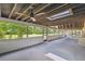 Large screened-in back porch with views of trees and greenery outside at 207 S Sweetwater Blvd, Longwood, FL 32779