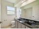 Bathroom featuring double sinks, a large mirror, and a shower/tub combo at 207 S Sweetwater Blvd, Longwood, FL 32779