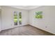 This bedroom has two windows that let in natural light and views of the backyard at 207 S Sweetwater Blvd, Longwood, FL 32779