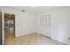 This bedroom has access to the back porch, tile flooring, and a double closet at 207 S Sweetwater Blvd, Longwood, FL 32779