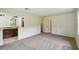 Living room with sliding glass doors and a kitchen view is bright and airy at 207 S Sweetwater Blvd, Longwood, FL 32779