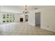 Open living space with tiled floors, neutral walls, and large windows for ample natural light at 207 S Sweetwater Blvd, Longwood, FL 32779