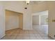 Spacious living area featuring tiled floors and neutral walls with two open doorways to adjacent rooms at 207 S Sweetwater Blvd, Longwood, FL 32779
