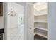 View from kitchen showing pantry with louvered door and custom shelving at 207 S Sweetwater Blvd, Longwood, FL 32779