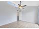 Light and bright bedroom with neutral paint, laminate flooring and a large ceiling fan creating a blank canvas at 208 Scottsdale Sq # 208, Winter Park, FL 32792