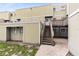 Charming condo showcasing a private entrance with wooden stairs and a cozy atmosphere at 208 Scottsdale Sq # 208, Winter Park, FL 32792