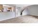 Open floor plan showcasing living room and kitchen with modern flooring and natural light at 208 Scottsdale Sq # 208, Winter Park, FL 32792