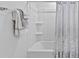 Clean and functional bathroom with a bathtub and towel rack at 232 Summerlin Loop, Haines City, FL 33844