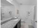 Bathroom featuring a granite vanity, framed mirror, and shower-tub combination at 232 Summerlin Loop, Haines City, FL 33844