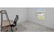 Well-lit bedroom with neutral carpet and ample natural light from the window at 232 Summerlin Loop, Haines City, FL 33844