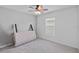 Bedroom with a ceiling fan, a window with blinds, and neutral carpet at 232 Summerlin Loop, Haines City, FL 33844