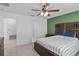 Inviting bedroom with wood furniture, ceiling fan, and ample natural light at 232 Summerlin Loop, Haines City, FL 33844