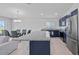 Spacious kitchen featuring a center island, stainless steel appliances, and adjacent dining area at 232 Summerlin Loop, Haines City, FL 33844