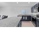 Spacious kitchen featuring granite countertops, stainless appliances, and ample cabinet space at 232 Summerlin Loop, Haines City, FL 33844