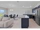 Open kitchen with an island, stainless appliances, and an open-concept design to the living area at 232 Summerlin Loop, Haines City, FL 33844